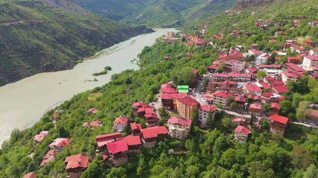 Aerial of Kemaliye town nestled along the winding Euphrates River valley. travel destination in Turkey.