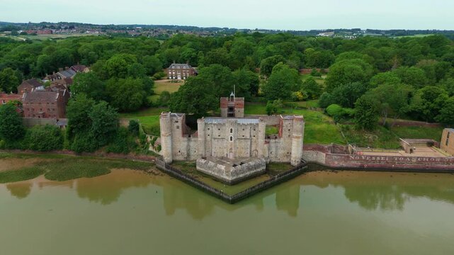 Aerial view of the historic Rochester Castle keep and medieval stone fortifications on the banks of the River Medway, Kent, UK.
