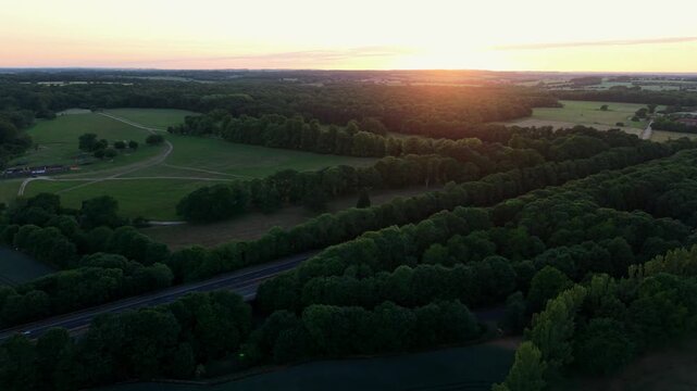 Aerial View of A1 Motorway Traffic in Golden Sunset Light at Dusk