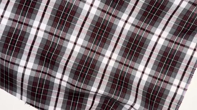 This red and gray plaid fabric consists of cotton and polyester providing a soft texture that holds shape perfectly and offers breathable comfort for sewing projects like shirts or daily dresses