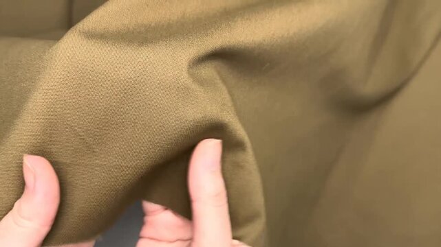 This olive green stretch cotton twill fabric features a soft texture and durable build with a slight diagonal rib that retains its shape and provides breathable comfort for any sewing project