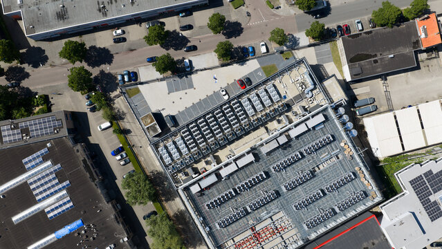 Aerial view of Switch Datacenters AMS4 showing extensive rooftop cooling units and HVAC systems in an industrial area of Diemen, Noord-Holland, Netherlands.
