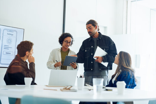 Man and woman lead design team meeting