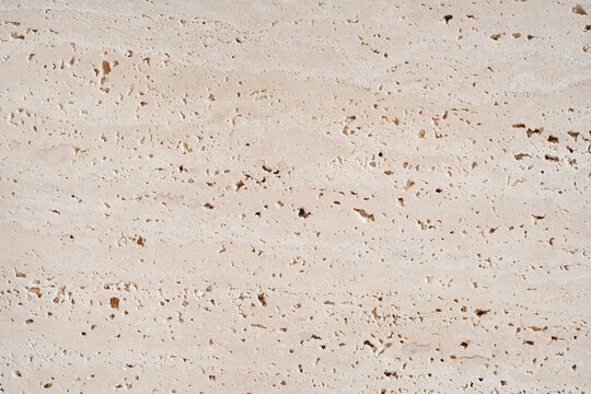 Travertine stone abstract texture background close-up macro at high resolution