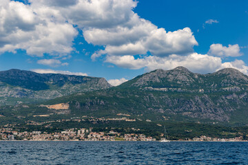 Fototapeta premium Rugged stone cliffs and pristine turquoise waters along the scenic Adriatic coastline near Herceg Novi