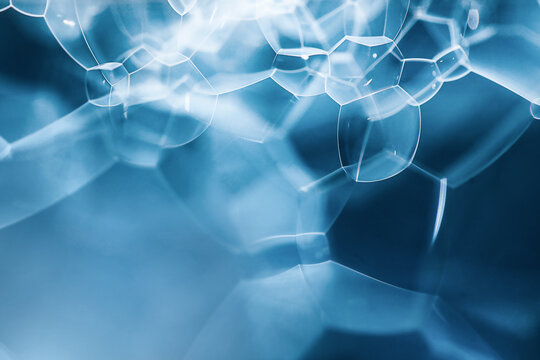 Abstract blue water bubbles texture with copy space, macro liquid foam structure for intensive hydration serum, mens grooming or refreshing cosmetic banner.