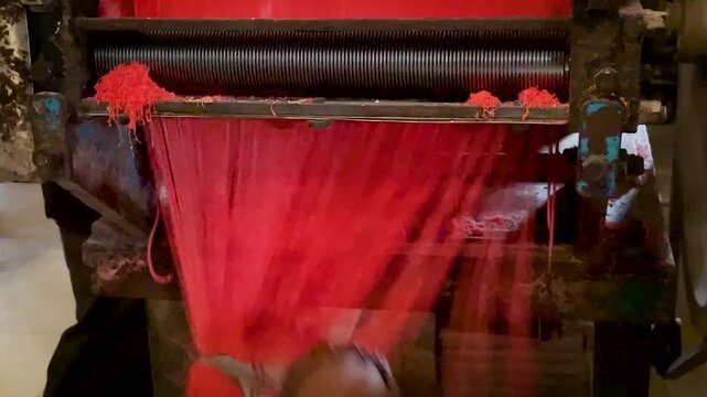 Red Noodle Strands Falling From Cutting Roller Machine in Traditional Mie Habang Workshop South Kalimantan Indonesia