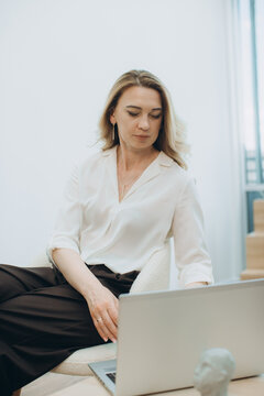 Woman working on laptop consulting online and learning