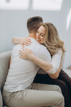 Woman smiling while embracing providing emotional support