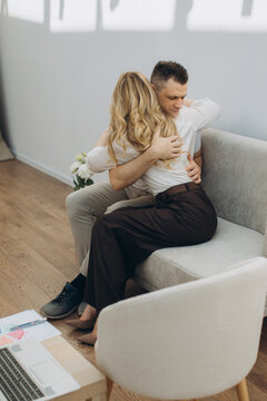 Couple embracing during therapy session, receiving support