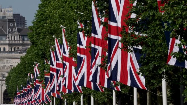 Row of union jack flags waving on The Mall in London