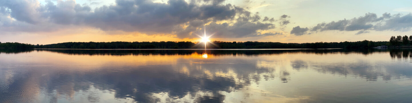 Sunset over a lake near the Bos Amsterdam forest