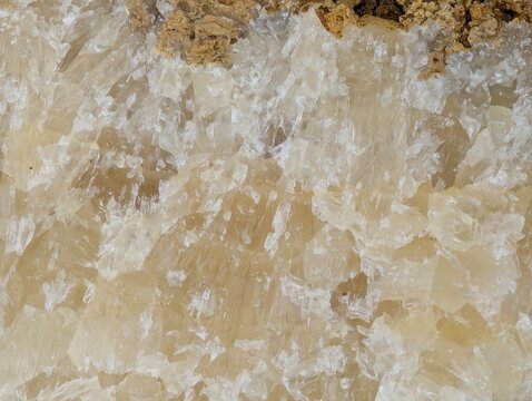 Close-up of translucent crystal formations with natural mineral texture, showcasing intricate structures and earthy tones for geology and background use.