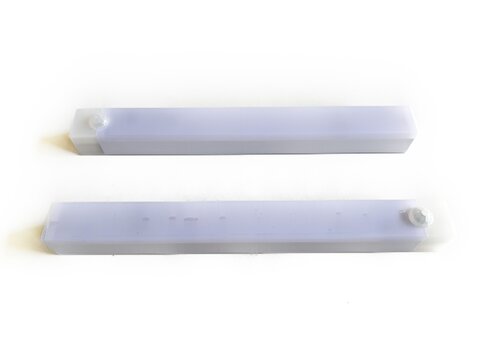 Two smart LED motion sensor light bars, isolated on white background. Portable wireless night lighting device for closet, cabinet, wardrobe, kitchen, and home automation product mockup.