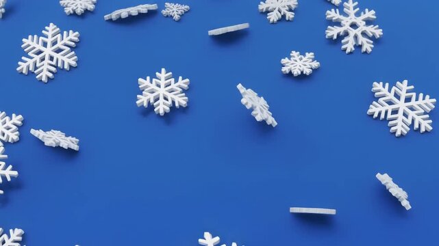 White snowflake shapes scattered on bright blue background, symbolizing winter season, geometric diversity, and festive holiday atmosphere.
