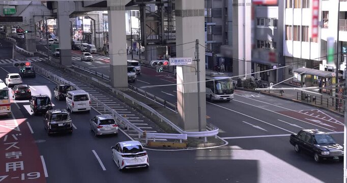 A cityscape of traffic jam at the city street under the overpass in Tokyo