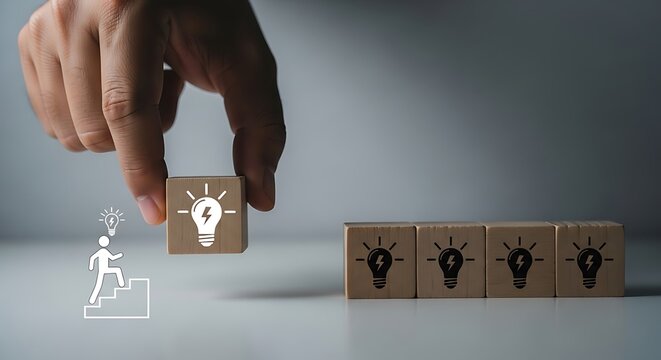 Hand placing lightbulb on wooden music note blocks minimalist creative concept