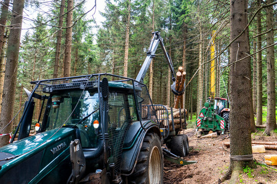 Pec pod Snezkou, Czech Republic - June 02, 2026: Heavy forestry machinery and cable yarding system extracting timber logs on a steep mountain slope