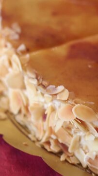 Close up view of a variety of freshly made desserts. Showcase of cakes, including saint honore, chocolate mousse, and strawberry tart
