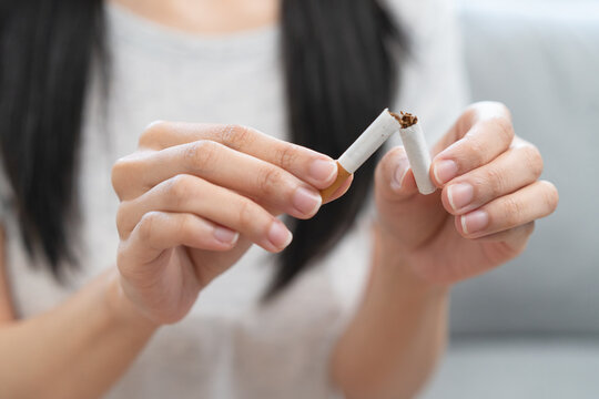 Close-up people destroy the tobacco and has the willpower to quit smoke.