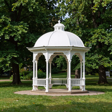 Minimalist Gazebo Dome. Peaceful And Scenic White Gazebo In Lush Green Park Amidst Trees, Marianske Lazne/Marienbad, Czech Republic