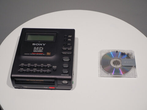 TOKYO, JAPAN - May 2, 2026: The first Sony MD Walkman, the MZ-1, and a MiniDisc. They're on display at a Sony exhibition.