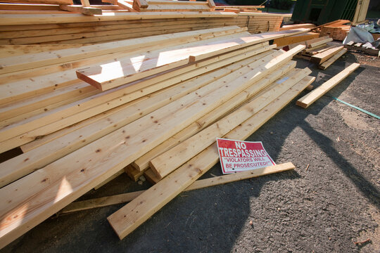 No Trespassing sign on pile of boards