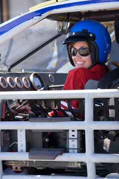 Smiling female disability auto racer