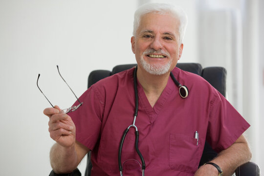 Portrait of doctor in chair