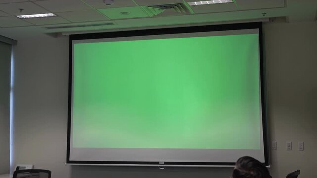 Blank Green Screen Projector Display in Modern Office Meeting Room