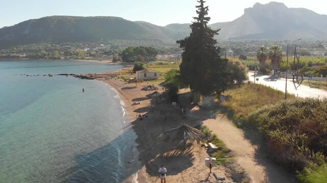Aerial view of Beach Paralia Kechrion near Corinth Canal, Greece. Drone view from above. Summer holidays destination

