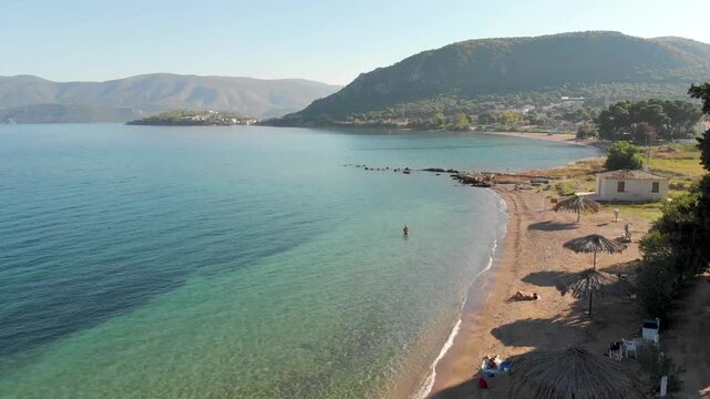 Aerial view of Beach Paralia Kechrion near Corinth Canal, Greece. Drone view from above. Summer holidays destination
