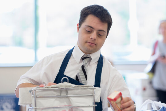 Man with Down Syndrome working at a grocery store