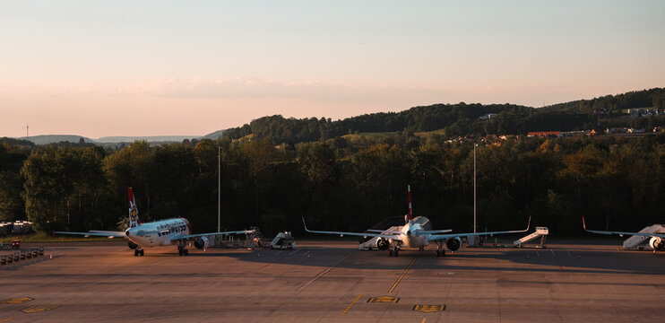 Zurich, Switzerland - May 29, 2025: Evening sky over zurich airport with aircraft preparing for departure