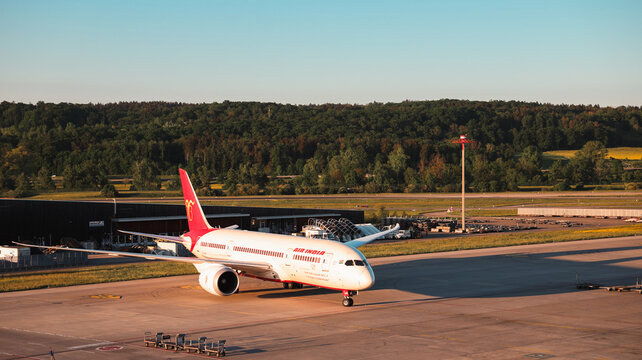 Zurich, Switzerland - May 29, 2025: Prominent aircraft preparing for departure at Zurich Airport during golden hour
