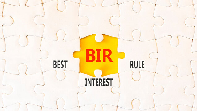 BIR best interest rule symbol. Concept words BIR best interest rule on beautiful white puzzles. Beautiful yellow background. Business BIR best interest rule concept. Copy space.