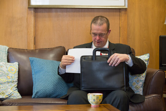 Man with Down Syndrome working as a Legislative Assistant in the State Capitol with his briefcase