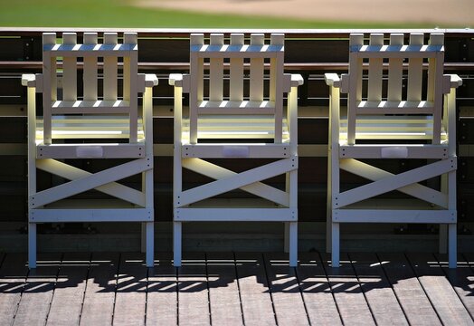 Beach style chairs line the edge at the right field wall of Petco Park, the Padres Baseball Stadium in San Diego, California USA.