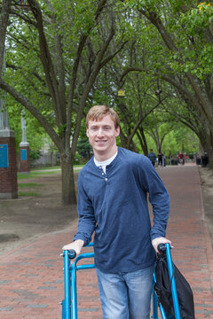 Young man with Cerebral Palsy and his walker