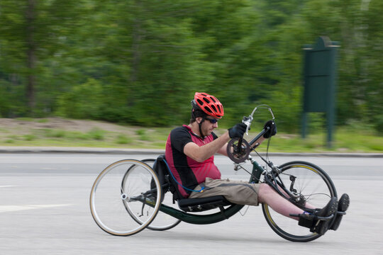 Man with spinal cord injury participating in a handcycle race