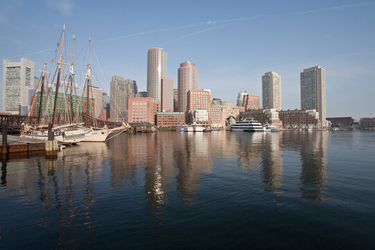 Boats with financial district on a harbor, Rowes Wharf