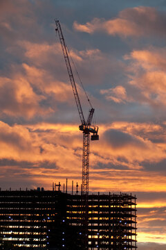 Crane at a construction site at dusk