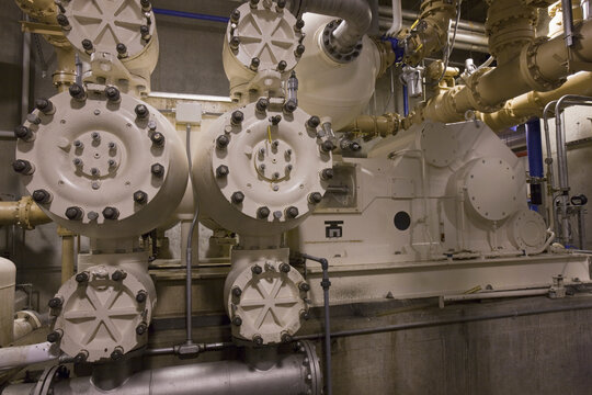 Heavy machinery with pumps and valves in a sewage treatment plant