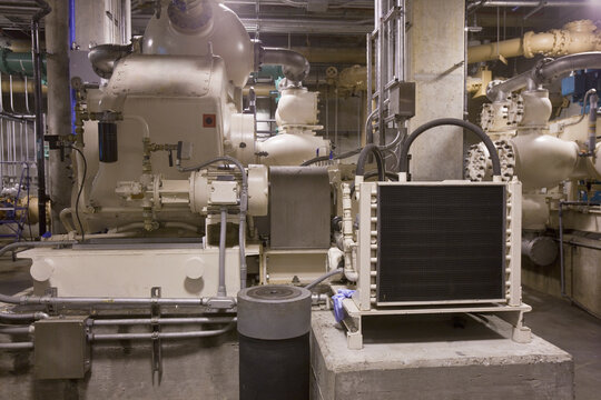 Heavy machinery with radiator unit and pumps in a sewage treatment plant