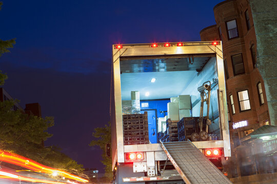 Unloading service truck at dusk