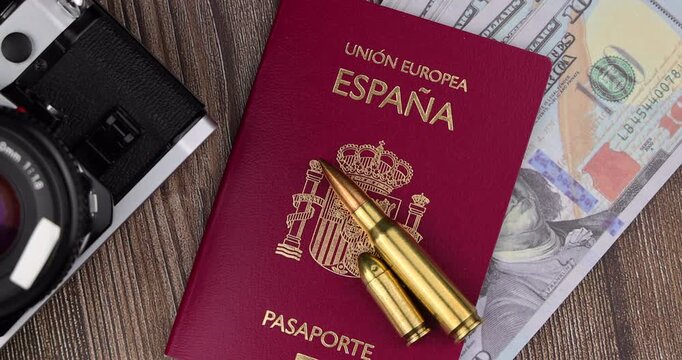 Sleek flatlay layout of official spain passport book and boarding pass airplane tickets arranged on a dark rustic wooden board