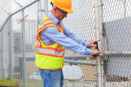 Electrical engineer using security system to enter electrical power plant
