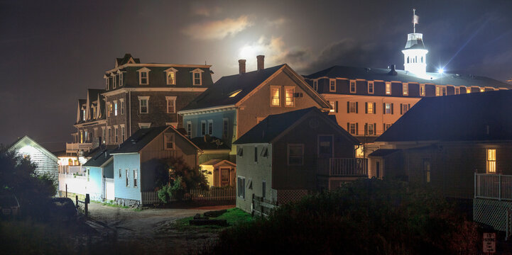Full moon over buildings at New Shoreham