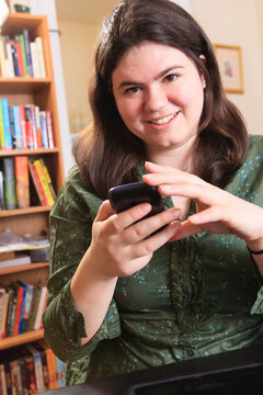 Woman with Asperger syndrome working with her smart phone
