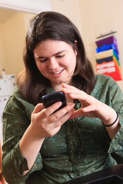 Woman with Asperger syndrome working with her smart phone